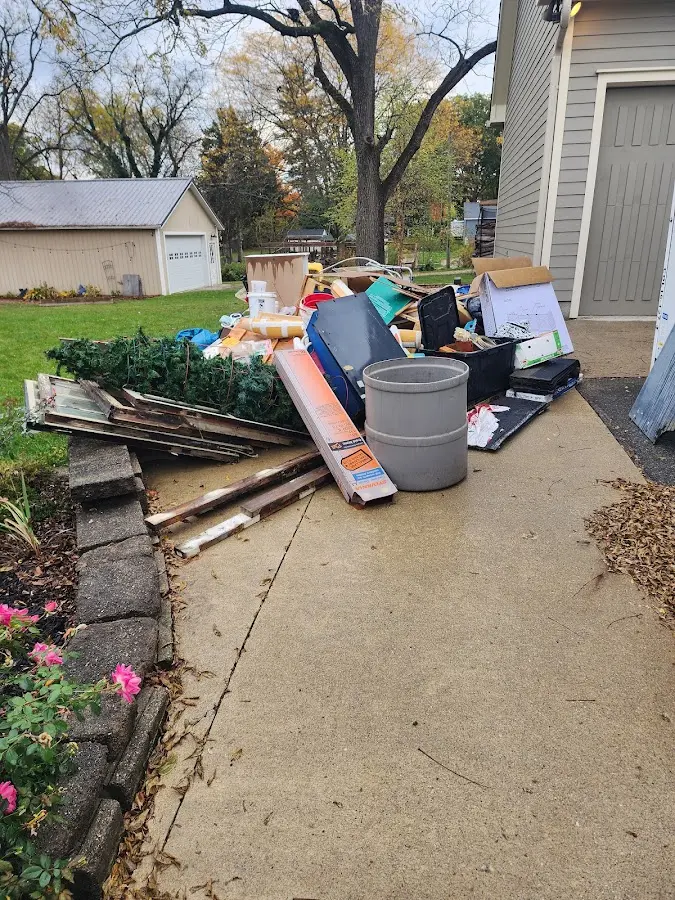 Dumpster being loaded with debris for Residential Dumpster Rental in Los Gatos